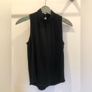 Black sleeveless turtle neck with open back